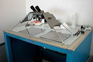 Stereoscope and light table used in attributing Blue Ridge Parkway infrared aerial photographs.