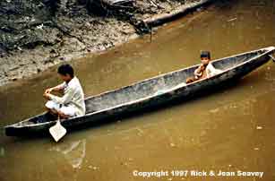 Yagua indian canoe with resident fishermen. 